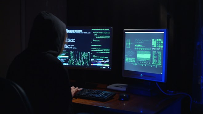 A female hacker in action using the co, Stock Video