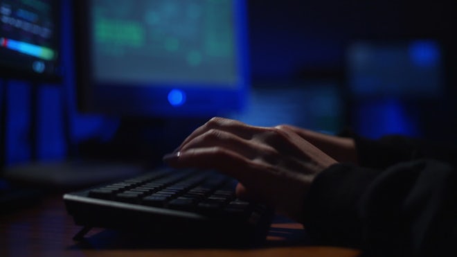 A female hacker in action using the co, Stock Video