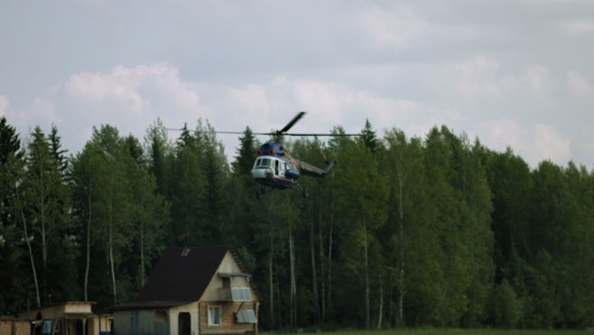 Helicopter Flying Over Houses: Stock Video